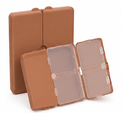 Opens to seven compartments under frosted, magnet-sealed lids.